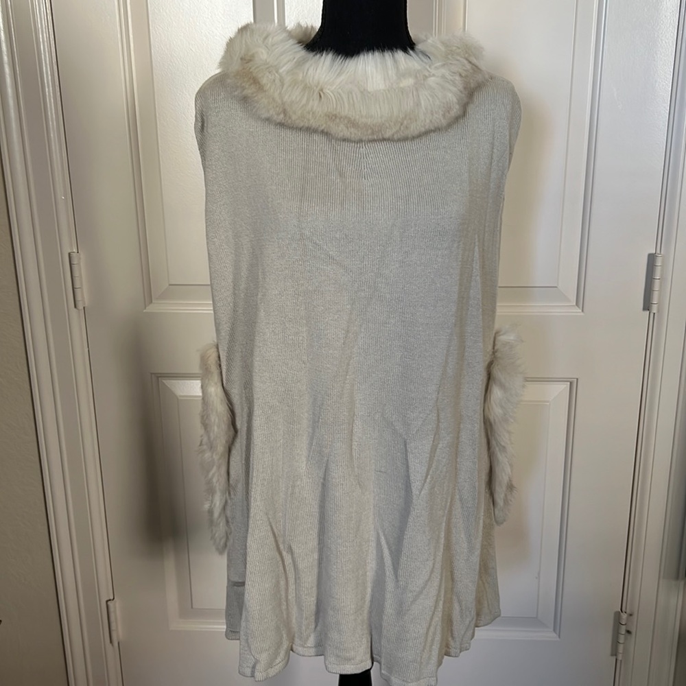 Faux fur trimmed knit poncho
